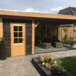 Voorkant Moderne overkapping met glaswanden 600x300cm