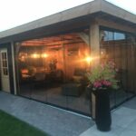 Sfeerimpressie Overkapping met glaswanden 600x300cm type 'Carolien'