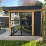 Douglas overkapping met steellook glaswand 600x300cm ‘type Jim’